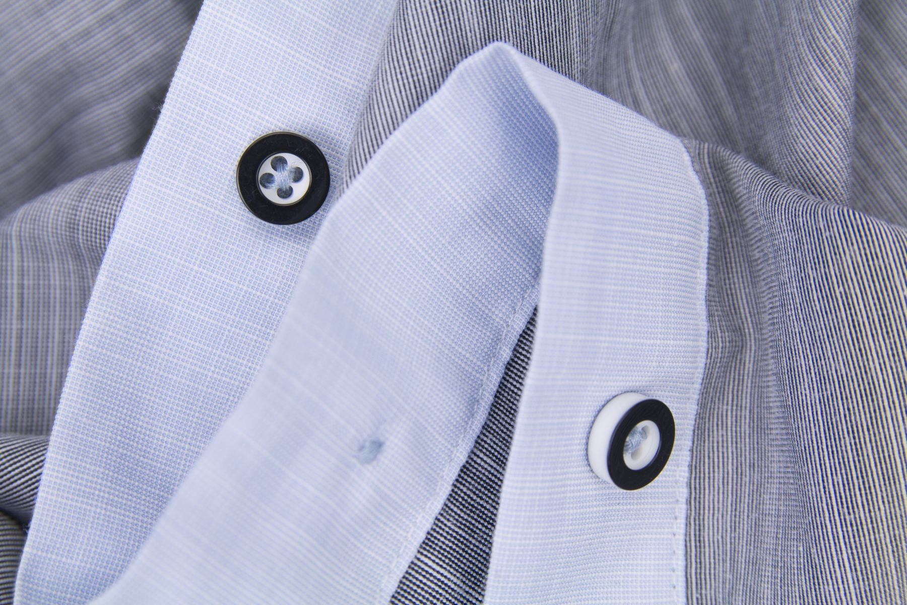 Light blue oxford cloth close-up showing basket weave texture