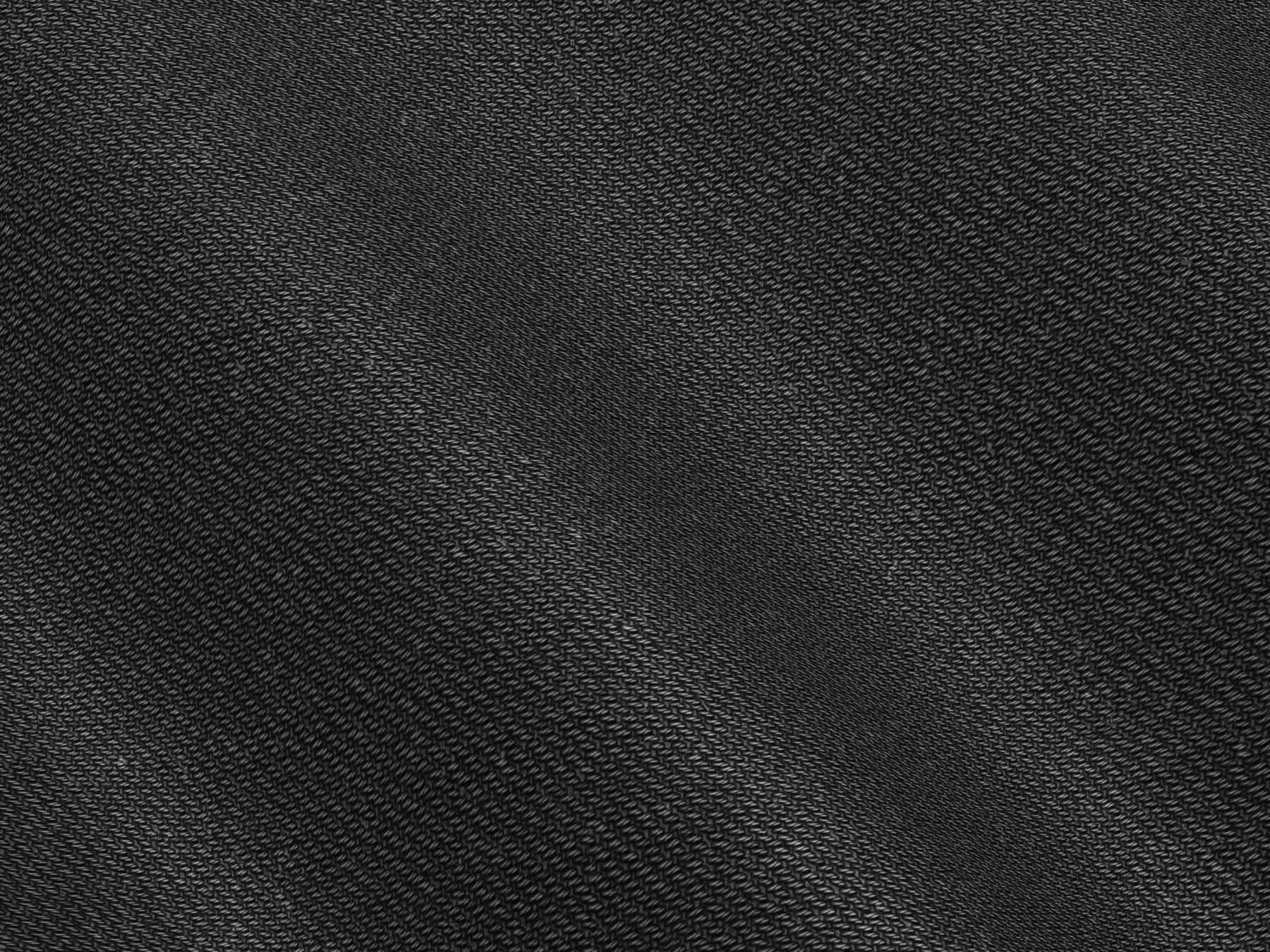 Close-up of navy polycotton twill fabric showing diagonal weave