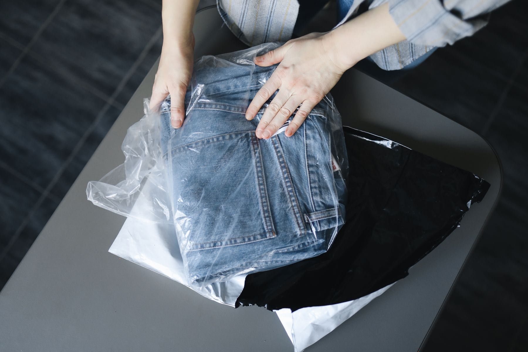 Folded uniform shirts in polybags with name and size stickers